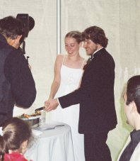 Jocelyn and Steve cut the cake together.