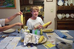 Phil displays an ear of sweet corn.