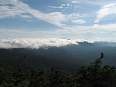 mountains with clouds resting atop