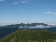 three mountains, each above the other